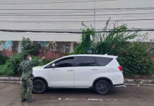 Military man found dead A personnel of Police Station 1 secures the car of a military member who was found dead in Barangay 12, Bacolod City on Oct. 12. POLICE STATION 1
