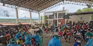 Priority residents wait their turn to avail themselves of free anti-coronavirus disease jabs in Barangay Ungka, Pavia, Iloilo. PHO