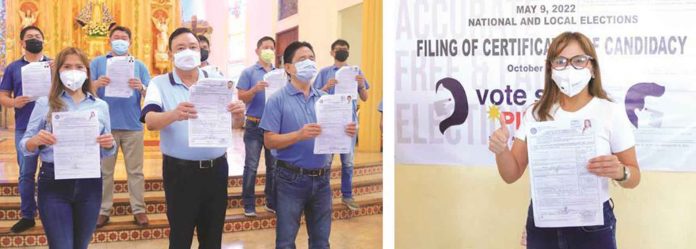 front-pic UNITED THEY STAND. After hearing a Mass at the Our Lady of Voyage Parish in La Paz district on Wednesday, Iloilo City Lone District’s Cong. Julienne “Jam-jam” Baronda, Mayor Jerry Treñas, Vice Mayor Jeffrey Ganzon and their candidates for councilor show their certificates of candidacy (COC). Right photo shows reelectionist Baronda after filing her COC at the city election office.