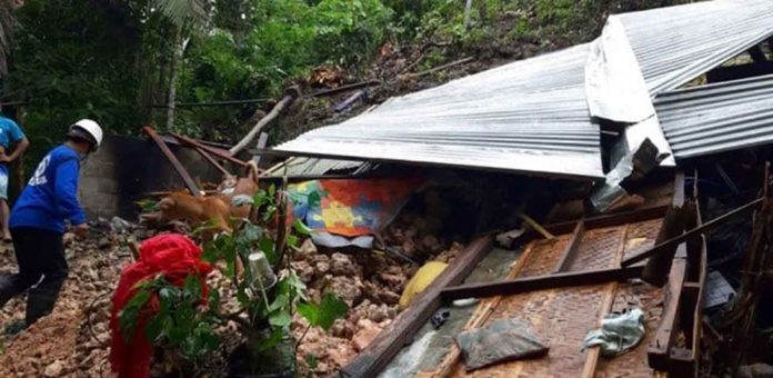 guimaras-rockslide-(4) In Sitio Buro, Barangay Dagsaan, Buenavista, Guimaras, the continuous rains brought by Tropical Depression “Lannie” caused a slight movement of soil down mountain slopes, causing a rockslide that destroyed houses.