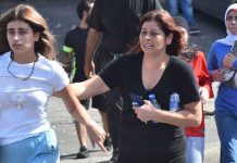 People run for cover as gunfire sounds in Beirut. GETTY IMAGES