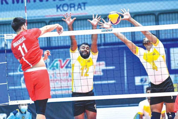 rebisco Rebisco-Philippines’ Joshua Umandal slams the ball towards the defense of CEB Sports Club player. SMNI PHOTO