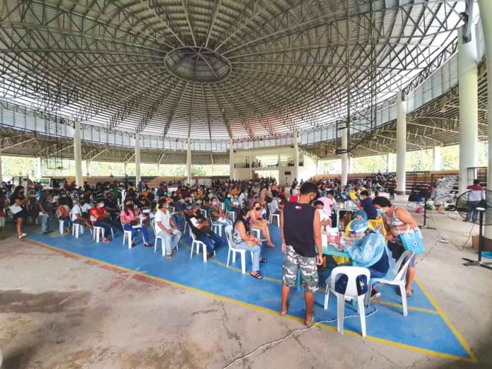 vax BRGY-BASED VAXX. Eligible residents wait their turn to get vaccinated against coronavirus disease 2019 at the municipal gymnasium of New Lucena, Iloilo. PHO