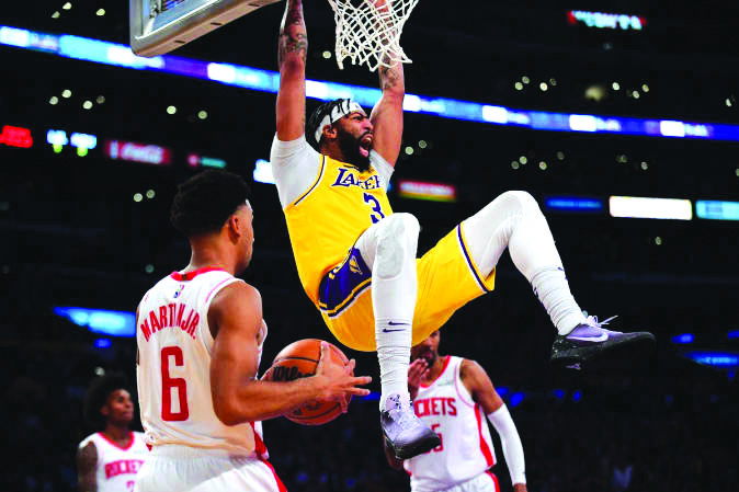 Los Angeles Lakers forward Anthony Davis Los Angeles Lakers forward Anthony Davis (3) dunks for a basket in front of Houston Rockets forward Kenyon Martin Jr. (6) at the Staples Center. PHOTO BY GARY A. VASQUEZ-USA TODAY SPORTS