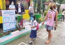 Day 1 of pilot F2F classes in WV a success – DepEd A learner walks with a guardian on the first day of the limited face-to-face classes in Laserna Integrated School in Nabas, Aklan. HERNANI ESCULLAR JR/DEPED-6 PHOTO