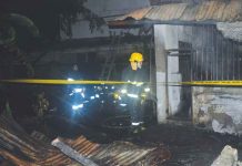 Arson investigators cordon the fire-hit candle factory in Barangay Bantud, La Paz, Iloilo. PANAY NEWS PHOTO