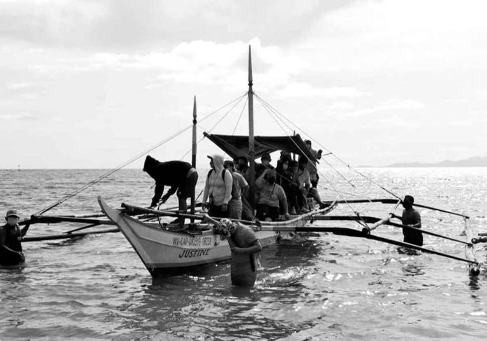 island-vax1 The island barangay of Olotayan is one of the farthest villages of Roxas City. So as not to inconvenience its residents, the city government deemed it wise to hold vaccinations against coronavirus disease in the island. The vaccines were transported by boat. PHOTOS FROM MAYOR RONNIE DADIVAS’ FACEBOOK PAGE