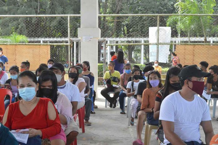 leganes-2 The Department of Health hopes to inoculate more Western Visayans in the three-day national vaccination drive against coronavirus disease 2019. Photo shows people waiting their turn for vaccination in Leganes, Iloilo. PANAY NEWS