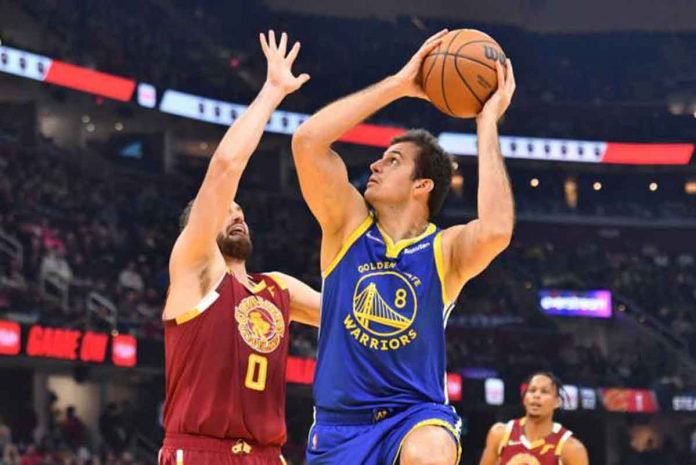 sports-curry-pic Golden State Warriors’ Nemanja Bjelica (8) tries to score against the defense of Cleveland Cavaliers’ Kevin Love (0). PHOTO BY JASON MILLER/GETTY IMAGES