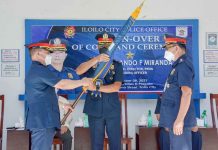 The outgoing Iloilo City Police Office (ICPO) director, Police Colonel Uldarico Garbanzos, turns over the ICPO flag to Police Colonel Leo Batiles. The turnover is led by Police Brigadier General Rolando Miranda, regional police director.