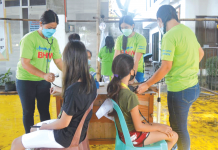 Over 30K minors in Iloilo get anti-COVID shots Health workers of Barangay Balabag, Pavia, Iloilo check the blood pressure of children prior to coronavirus disease 2019 inoculation. The town has so far vaccinated 1,709 youngsters. PANAY NEWS PHOTO