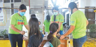 Health workers of Barangay Balabag, Pavia, Iloilo check the blood pressure of children prior to coronavirus disease 2019 inoculation. The town has so far vaccinated 1,709 youngsters. PANAY NEWS PHOTO