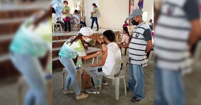 A youngster gets his first dose of the vaccine against coronavirus disease at the Dr. Catalino Gallego Nava Memorial High School in Barangay Constancia, San Lorenzo, Guimaras. PHOTOS FROM GUIMARAS PROV’L GOV’T