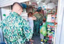 Zarraga store ransacked Policemen survey a store ransacked by robbers yesterday in Barangay Poblacion Ilawod, Zarraga, Iloilo. PANAY NEWS PHOTO