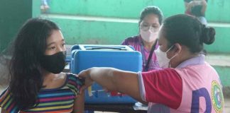 An eligible young resident of Patnongon, Antique is being vaccinated against coronavirus disease during the first round of “Bayanihan Bakunahan” from Nov. 29 to Dec. 1. 2021. PHOTOS FROM PATNONGON LGU