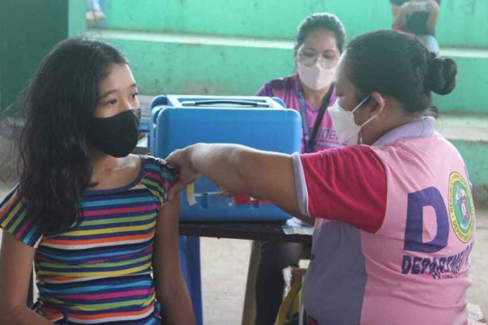 Patnongon-2 An eligible young resident of Patnongon, Antique is being vaccinated against coronavirus disease during the first round of “Bayanihan Bakunahan” from Nov. 29 to Dec. 1. 2021. PHOTOS FROM PATNONGON LGU