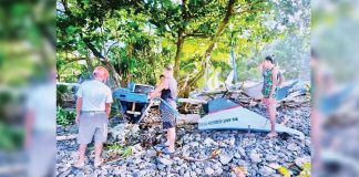 Fishermen of Libertad, Antique check their boats that the storm surge brought by super typhoon “Odette” destroyed. PHOTO FROM FACEBOOK PAGE OF MAYOR BEBOT NICOPIOR TE