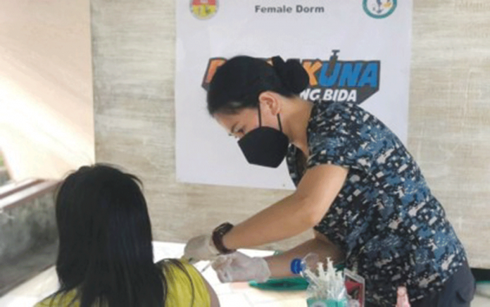 booster A person deprived of liberty at the Metro Bacolod District Jail - Female Dormitory gets a vaccine booster shot against coronavirus disease. PHOTO BY METRO BACOLOD DISTRICT JAIL - FEMALE DORMITORY