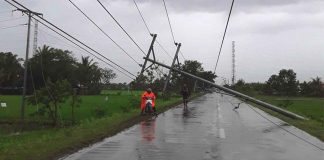 Electric posts in Barangay Lapayon, Leganes, Iloilo collapsed due to the strong winds of super typhoon “Odette”. The collapse triggered a long power interruption and rendered the road impassable. Residents urge the Iloilo Electric Cooperative 1 to fix the broken posts as quickly as possible. PN PHOTO