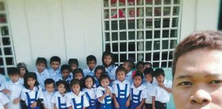 Teacher Argy Catolin with the 26 learners of the Aglonok Primary School in Barangay Aglonok, Calinog, Iloilo.  