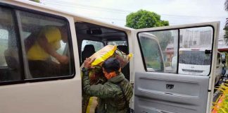 A Philippine Army soldier carries to a waiting vehicle a sack of relief goods for distribution to people displaced by super typhoon “Odette”. PHOTO FROM PROVINCE OF ANTIQUE FACEBOOK PAGE