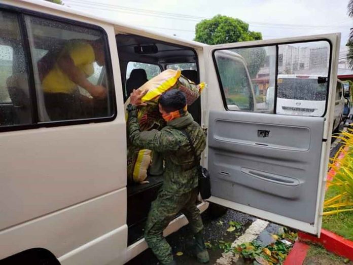 region-zeero-pic A Philippine Army soldier carries to a waiting vehicle a sack of relief goods for distribution to people displaced by super typhoon “Odette”. PHOTO FROM PROVINCE OF ANTIQUE FACEBOOK PAGE