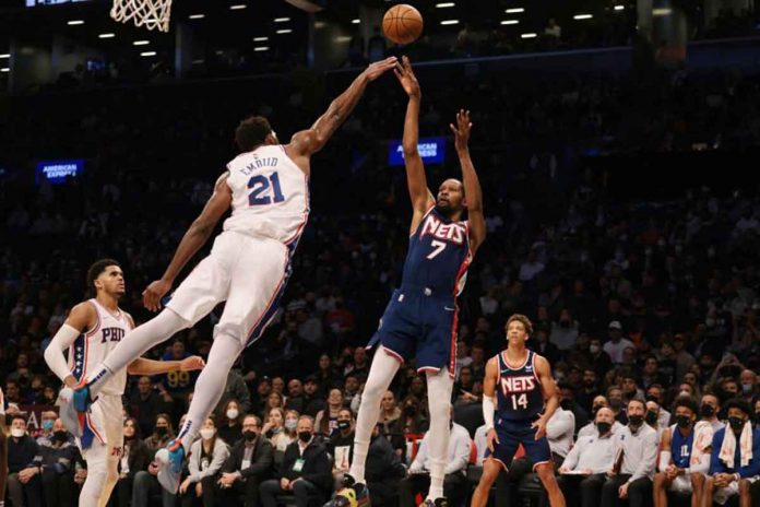 sports-clutch-pic Brooklyn Nets forward Kevin Durant (7) shoots the ball as Philadelphia 76ers center Joel Embiid (21) defends at the Barclays Center. PHOTO BY VINCENT CARCHIETTA, USA TODAY SPORTS