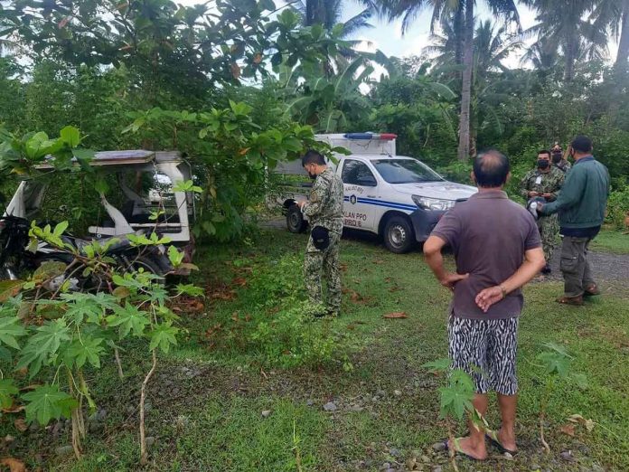 trike Policemen of Numancia, Aklan check this tricycle abandoned in Sitio Pigado, Barangay Bakhaw Sur, Kalibo, Aklan. It was used as a getaway vehicle of the men who stabbed to death its driver on Nov. 27, 2021.
