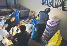 RLC Residences extends relief efforts to Odette-hit homeowners and stakeholders Property Management Offices team during the repacking of relief packs for affected residents and employees.