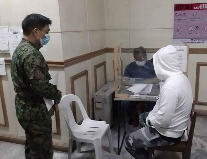 SIT A hooded witness submits to the Iloilo Provincial Prosecutor’s s Officer an affidavit supportive of the murder complaint that the Iloilo Police Provincial Office filed against several persons in relation to the death of businesswoman Claire Diergos of Pavia, Iloilo. IME SORNITO/PN