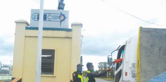 SHOW YOUR VAX CARD. Security guards of the Philippine Ports Authority in Iloilo City check the vaccination card of this cargo truck driver before letting him in. Those not vaccinated against coronavirus disease are turned away. PN PHOTO
