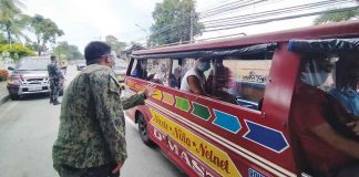 A police officer in Iloilo City makes sure passengers of this public utility jeepney are observing physical distancing. The Land Transportation Office and Land Transportation Franchising and Regulatory Board are eyeing 70 percent maximum seating capacity in jeepneys. PN Photo