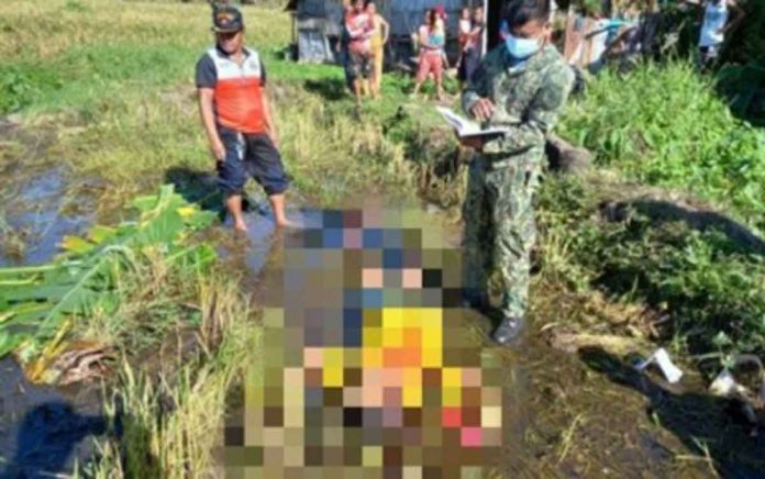 justice A police investigator documents the shooting of Mario Landisa, a resident of Sitio Mantuhod, Barangay Cabacungan, La Castellana, Negros Occidental on Dec. 20, 2021. The victim died. He was shot by four men who introduced themselves as rebels, after refusing to give food and cash as their family was then reeling from the devastation of super typhoon “Odette”. PHOTO BY 303RD INFANTRY BRIGADE, PHILIPPINE ARMY