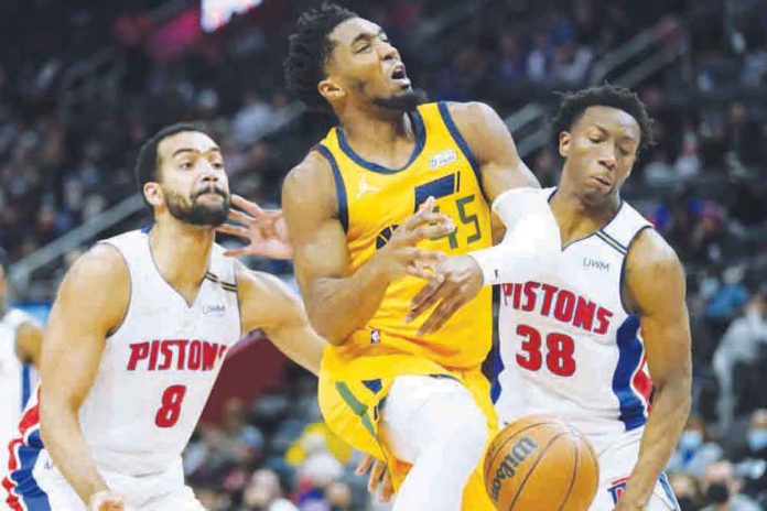 sports-detroit Utah Jazz’s Donovan Mitchell (45) loses the ball after being swiped by Detroit Pistons' Saben Lee (38). PHOTO BY CARLOS OSORIO/AP