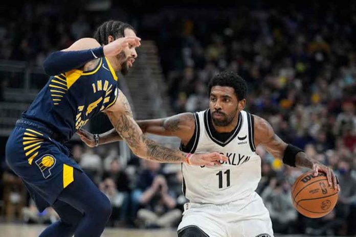 sports-durant-pic Brooklyn Nets’ Kyrie Irving wards off the defense of Indiana Pacers’ Duane Washington Jr. AP