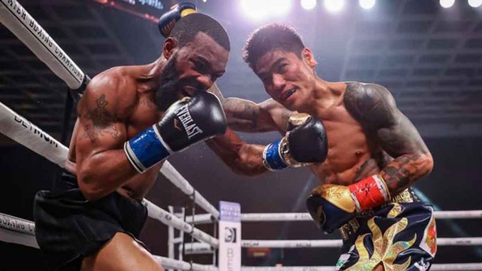 sports-magsayo-pic Filipino fighter Jessel Mark Magsayo evades the punch of American Gary Russell Jr. during their world title clash on Saturday night. SHOWTIME PHOTO