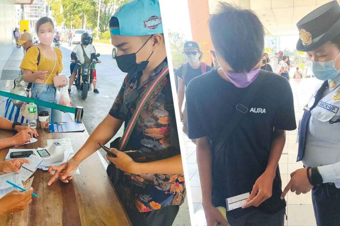 vax-card WHERE IS YOUR VAX CARD? A young man (left photo) going to Guimaras Island presents his COVID-19 vaccination card, identification card and outbound pass to inspectors at the Parola wharf in Iloilo City. Right photo shows a security guard checking the vaccination card of a boy entering a mall in Mandurriao, Iloilo City. The card inspections aim to restrict the movement of the unvaccinated to supposedly curb the spread of coronavirus. PN PHOTO