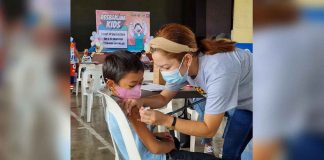Brave boy gets vaccinated during the Resbakunahan at Northwestern Visayas Colleges Gym in Kalibo, Aklan last February 15.