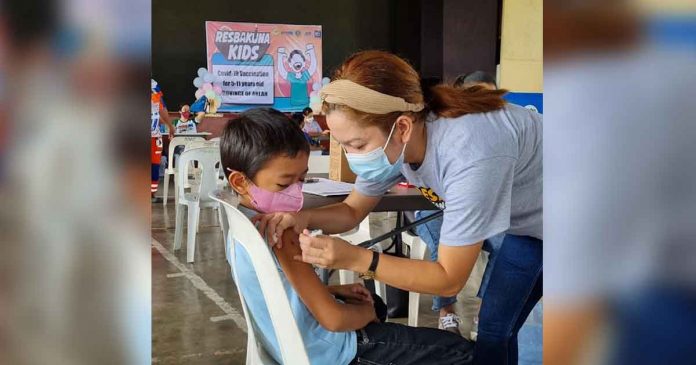 Brave boy gets vaccinated during the Resbakunahan at Northwestern Visayas Colleges Gym in Kalibo, Aklan last February 15.
