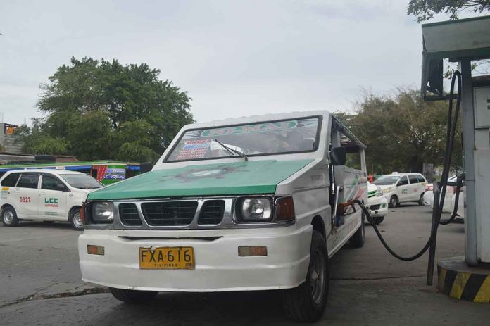 front-jeep-pic Jeepney drivers in Iloilo City are calling for a fuel price rollback and the suspension of the excise tax on fuel, or for an increase in the minimum fare so they could cope with the continuing rise in the prices of fuel. Photo shows a passenger jeepney refueling in Jaro district. PN PHOTO