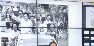‘WE DON’T WANT TO FORGET’. The photo behind Gov. Arthur Defensor Jr. of Iloilo was shot in the province of Antique just weeks before the February 1986 People Power Revolution that ousted dictator Ferdinand Marcos. It shows Marcos challenger Corazon Aquino and running mate Salvador Laurel campaigning for the Feb. 7, 1986 snap presidential election. Behind Aquino is the governor’s father, then Assemblyman Arthur Defensor Sr., an opposition leader in Iloilo. CAPITOL PIO PHOTO