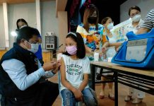 Iloilo ‘pedia’ vaccination halted A young girl stays calm while being vaccinated against coronavirus disease by Dr. Adriano Suba-an, director of the Department of Health – Region 6, at the West Visayas State University Cultural Center, one of several vaccination sites of the provincial government of Iloilo. PN PHOTO