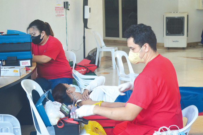 pwd-blood-donor BLOOD DONATION. A nurse prepares a person with disability, a blood donor during Feb. 12’s bloodletting activity at the Iloilo provincial government. The noble act will surely serve as an inspiration to many. Donated blood is a priceless gift to those in need. PN PHOTO