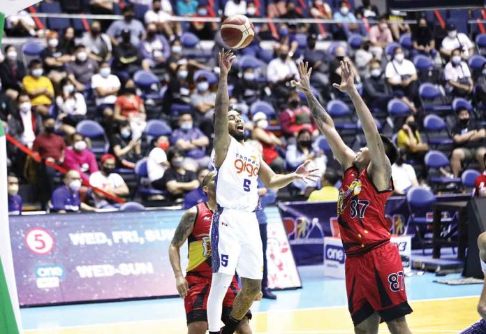 sports-TNT TNT Tropang Giga’s Mikey Williams attempts a one-hander against the defense of San Miguel Beermen’s Vic Manuel. PBA MEDIA BUREAU