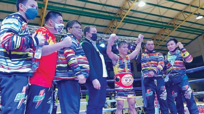 Rene Mark Cuarto retains his IBF world mini-flyweight championship following a technical majority decision over Pedro Taduran. CONTRIBUTED PHOTO