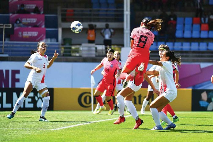 sports-malditas South Korea’s Cho So Hyun (8) smashes the ball as Philippine Malditas’ Tahnai Annis (5) looks on. AFC PHOTO