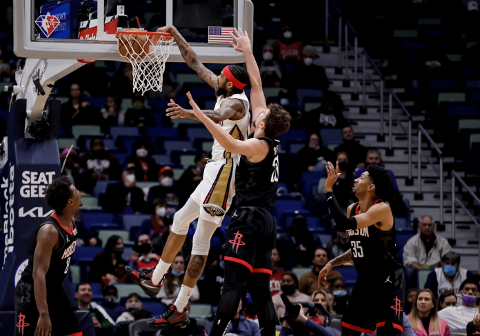 sports-new-orleans-pic New Orleans Pelicans forward Brandon Ingram (No. 14) dunks over Houston Rockets center Alperen Sengun (No. 28) during the first quarter of an NBA basketball game in New Orleans. AP PHOTO/DERICK HINGLE