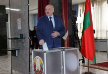 Belarusian President Alexander Lukashenko casts his ballot at the referendum on the amendments and additions to the Constitution of Belarus, in Minsk, Belarus February 27, 2022. Nikolay Petrov/BelTA/Handout via REUTERS