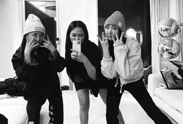 dara Dara, CL and Minzy of the defunct K-pop girl group 2NE1 posted the same photo of each other on their social media accounts on March 9, 2022. Instagram/@daraxxi