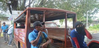 While waiting for passengers at the jeepney terminal in Barangay Ungka, Jaro, Iloilo City, two drivers ponder their fate. Fuel prices are increasing and straining their meager daily income. PN PHOTO